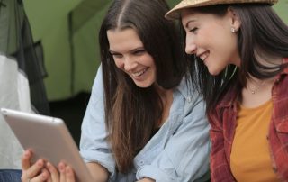 A variety of modern camping tents in a picturesque setting