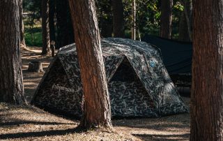 A lightweight camping tent set up in a scenic location