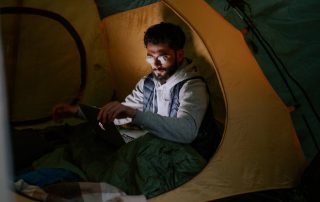 A high-tech camping tent featuring solar panels and LED lights
