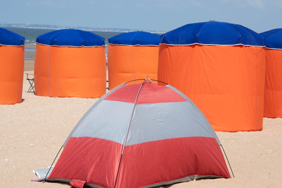 Image of a pop-up camping tent set up in a forest.
